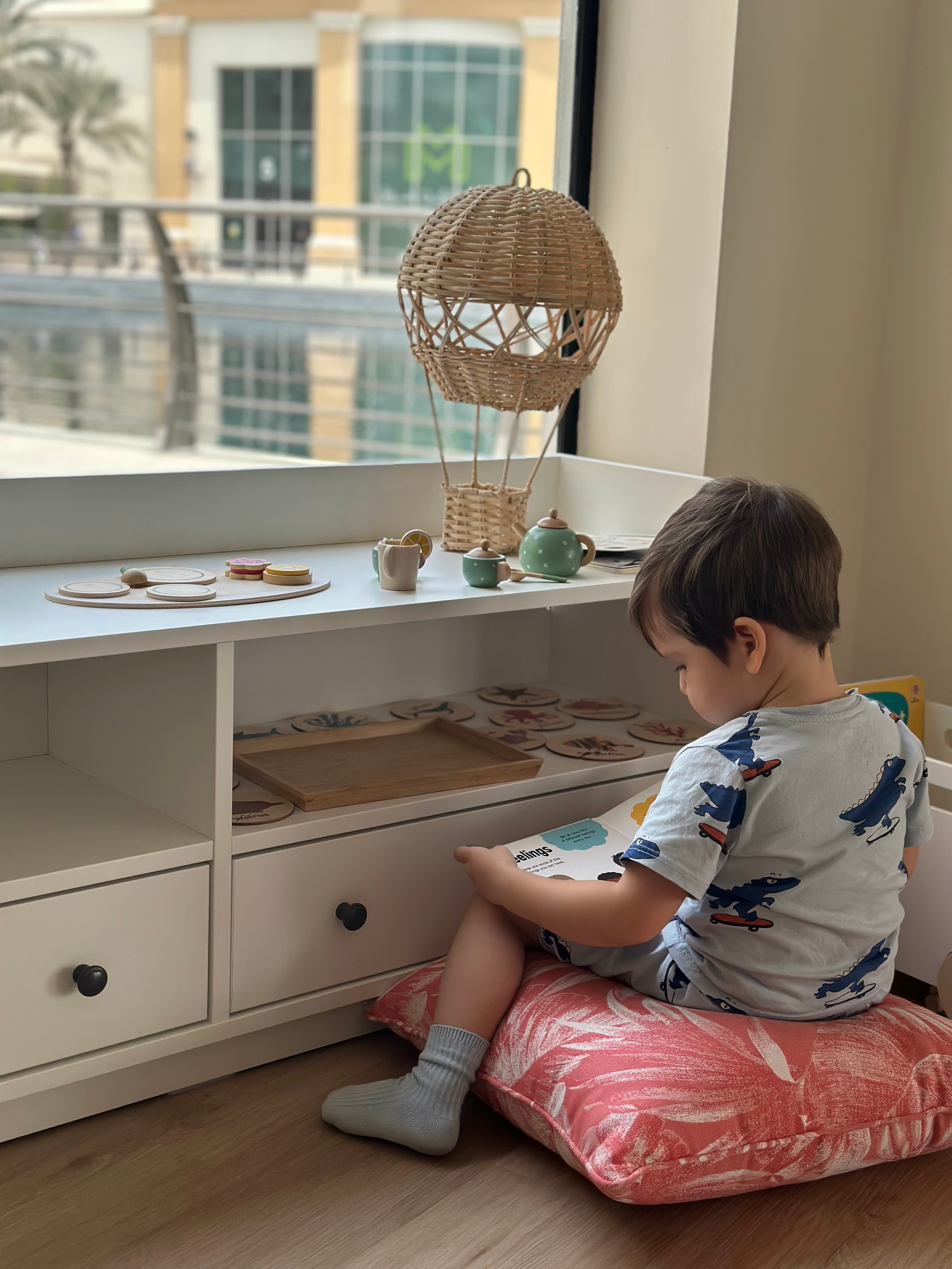 Happy child learning at Bloom Bright Nursery - Montessori-inspired early education in Dubai